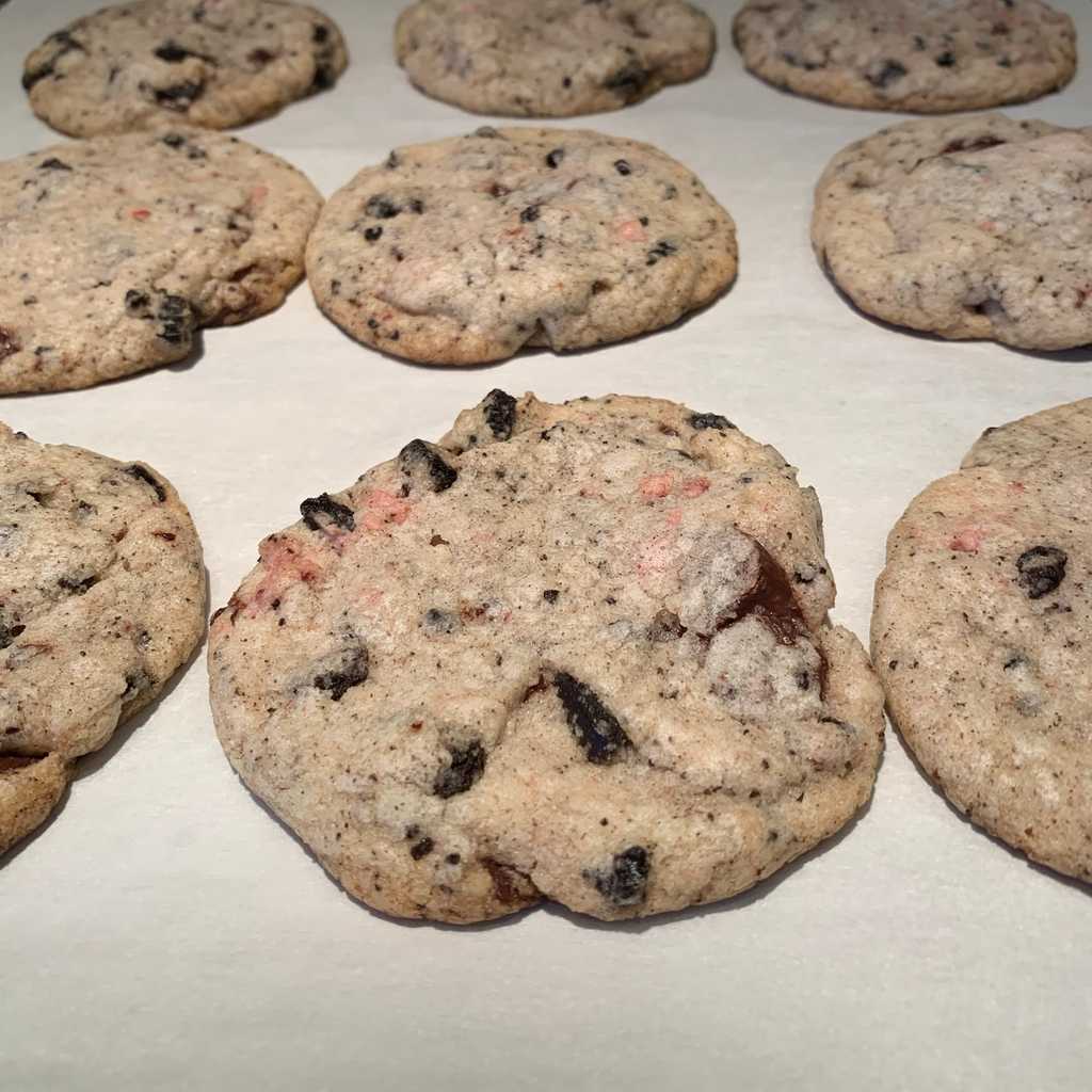 This recipe is a bit odd. Kind of an abomination, a chimera of disparate cookies and ice creams and fruits-made-powder. In Bravetart’s Snickerdoodle recipe, there is a variation for Cookies and Cream cookies. It demands that you skip the cinnamon sugar coating typical of a snickerdoodle, and fold in 8oz of frozen chopped Oreo cookies – preferably the Homemade Oreo Cookies contained in the same book – just before portioning the dough into cookie-sized balls and baking them.